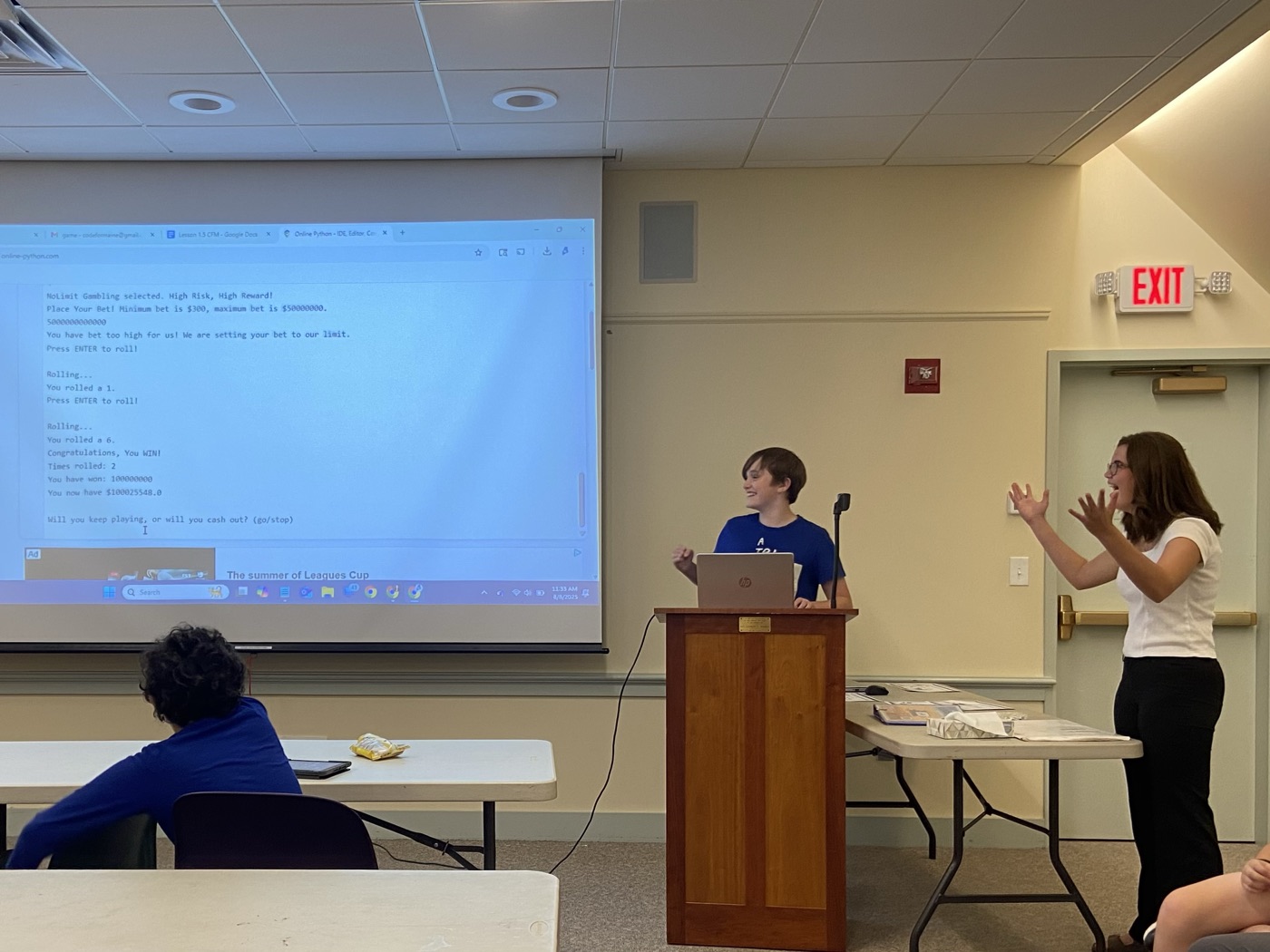 A student presenting code to the class